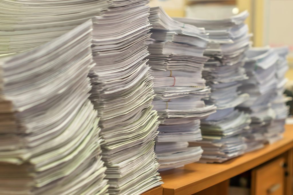 Piles of paper documents
