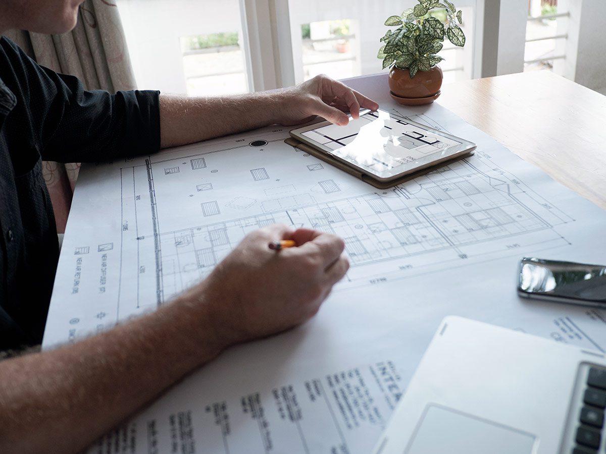 Engineer working on blueprints