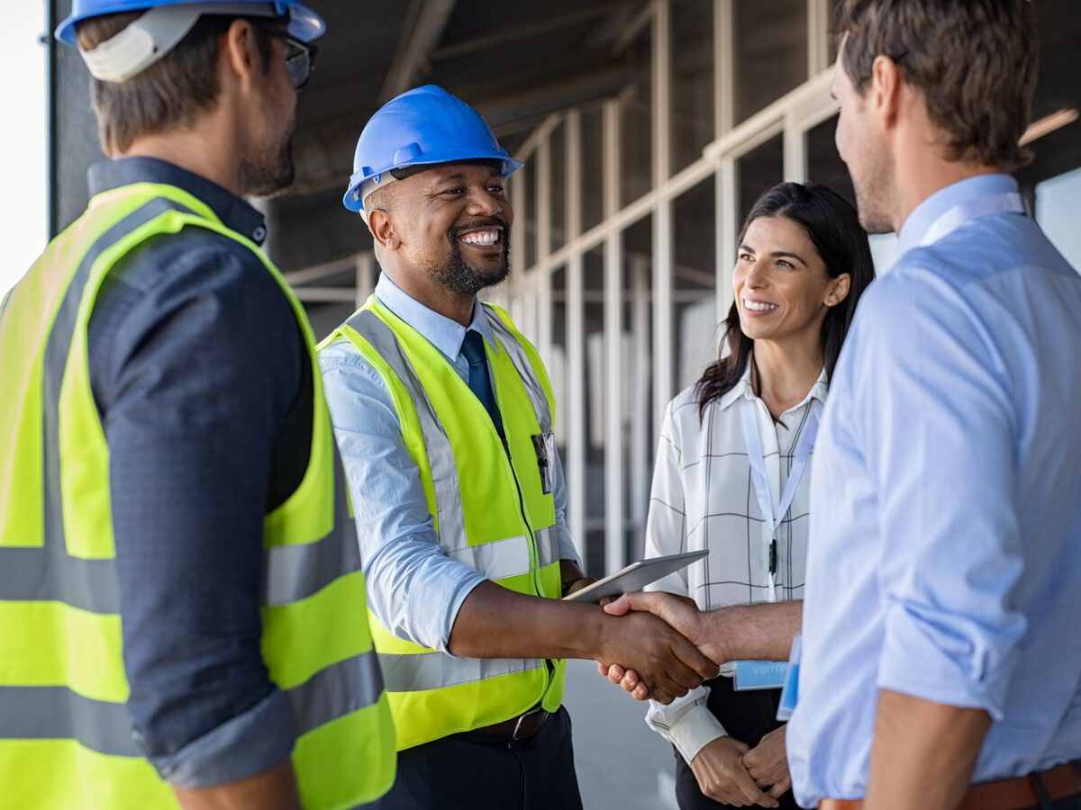 Engineer Shaking Hands At Construction Site